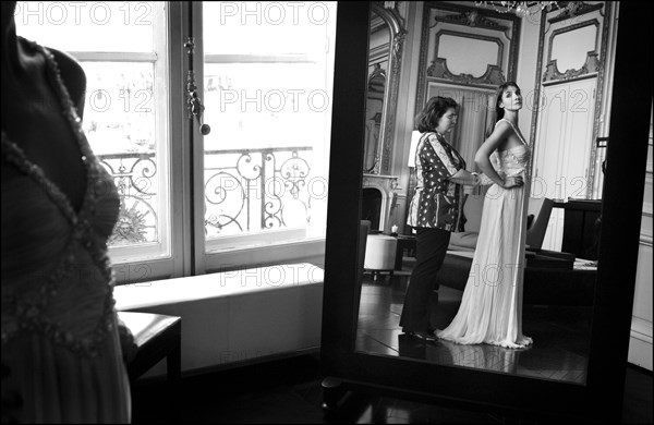 05/00/2003. Clotilde Courau tries gowns on at Valentino's before the 56th Cannes Film