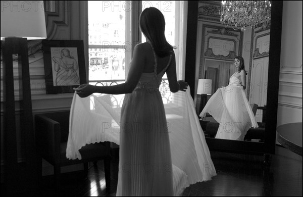 05/00/2003. EXCLUSIVE Clotilde Courau tries gowns on at Valentino's before the 56th Cannes Film