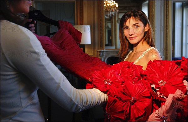05/00/2003. Clotilde Courau tries gowns on at Valentino's before the 56th Cannes Film