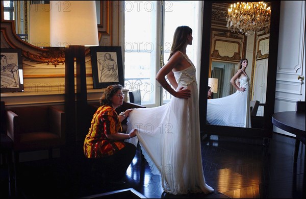 05/00/2003. Clotilde Courau tries gowns on at Valentino's before the 56th Cannes Film