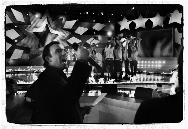 12/00/2003. Nikos Aliagas, host of the Star Academy shows backstage and on stage.