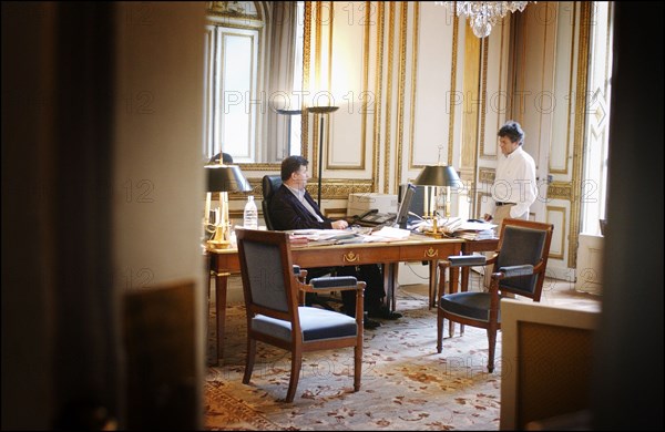 06/26/2004.  Jean-Louis Borloo, le ministre de l'Emploi, du Travail et de la Cohesion sociale travaillant, au ministere, sur le Plan de Cohesion sociale avant sa presentation en conseil des ministres le 30 juin prochain.