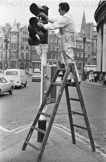 Painting traffic light, College Green, Dublin
