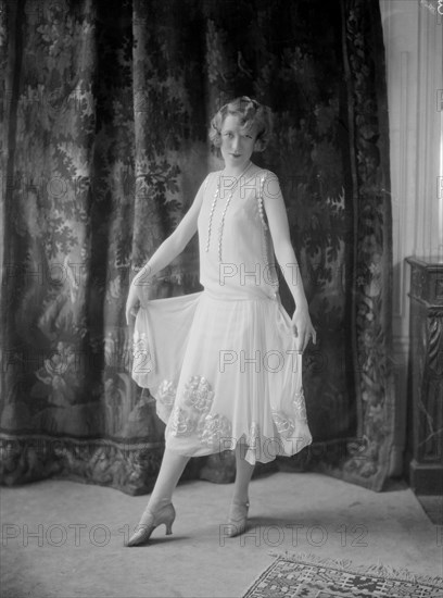 Annette Wills wearing a dress designed by Worth