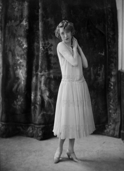 Annette Wills wearing a dress designed by Worth