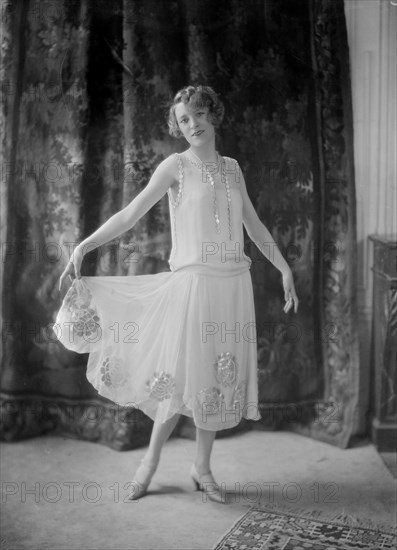 Annette Wills wearing a dress designed by Worth
