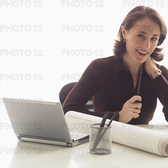 Portrait of a businesswoman at her desk.