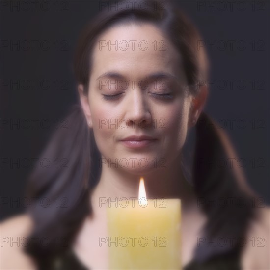 Woman with candle.