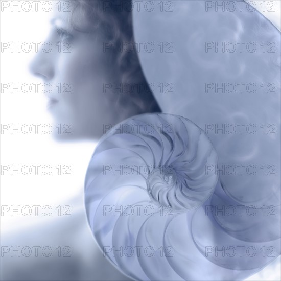 Woman's profile with nautilus.