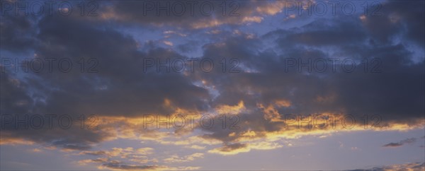 A hint of sunlight on clouds.