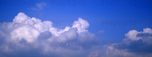 Puffy clouds and blue sky.