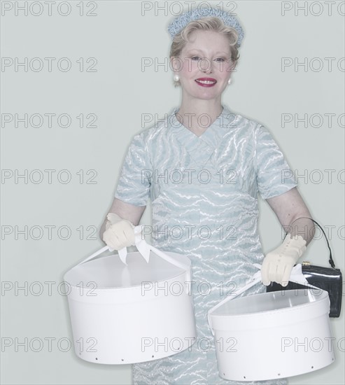 Woman with hat boxes.