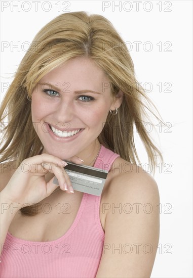 Smiling woman with credit card.