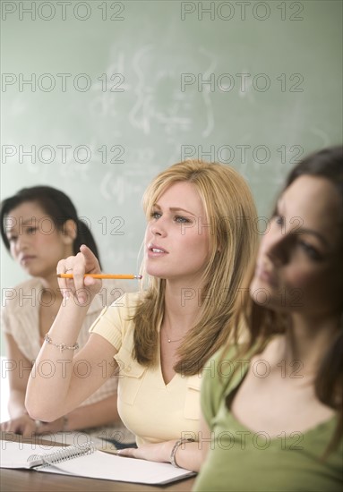 Young women in a college classroom.