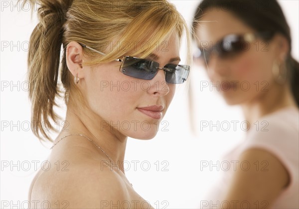 Portrait of women wearing sunglasses.