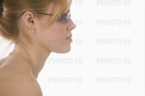Profile of woman wearing sunglasses.