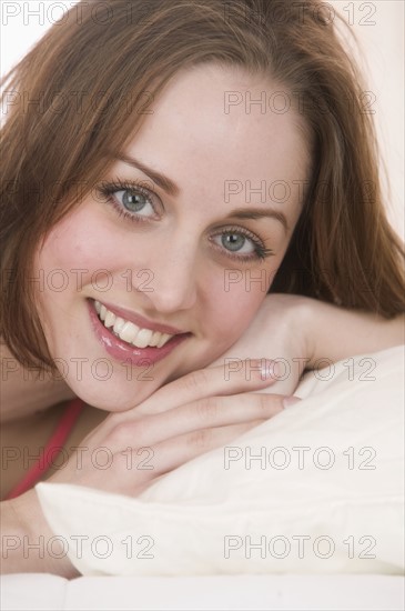 Headshot of smiling brunette.