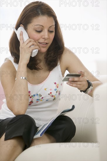 Woman shopping on phone.
