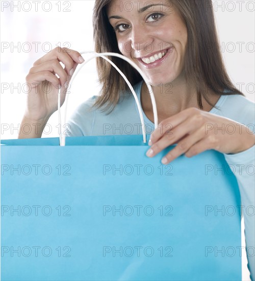 Young woman with shopping bag.