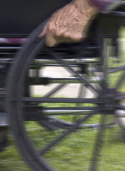 Elderly man in wheelchair.