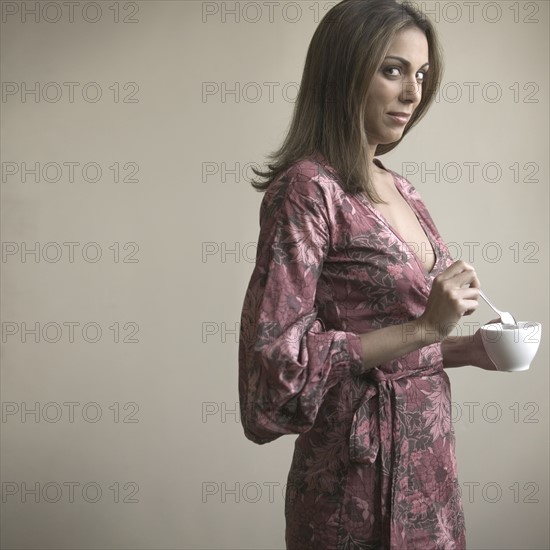 Woman with dark glasses and phone earpiece.