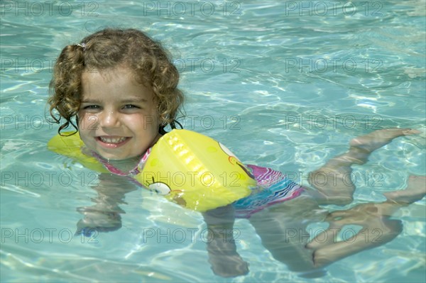 Little girl swimming.