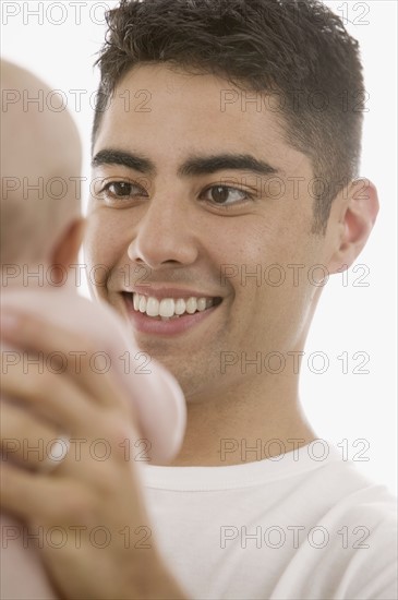 Father holding baby.