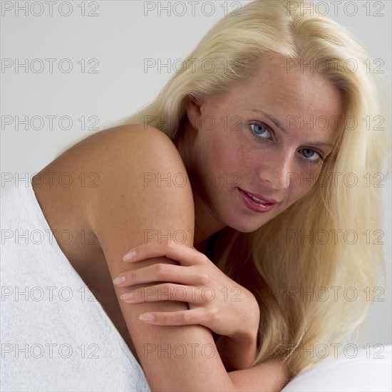 Young woman on a masseuse table.