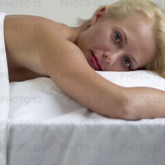 Woman relaxing on a masseuse table.