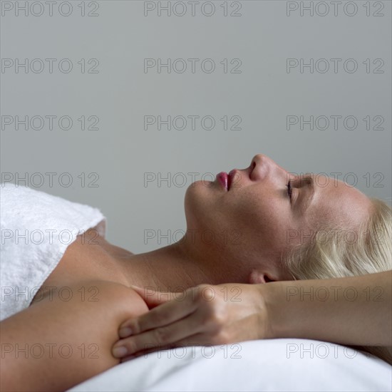 Young woman receiving a massage.