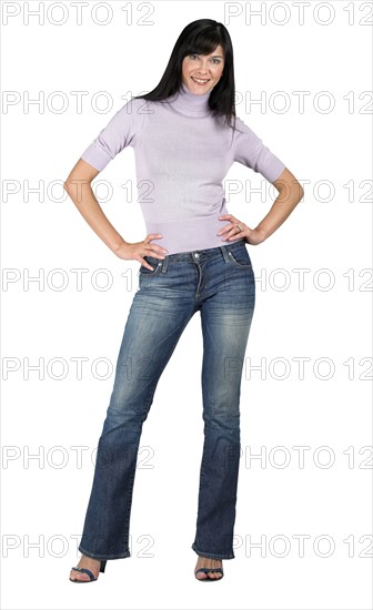 Woman standing with hands on her hips.