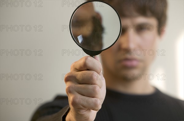 Man with magnifying glass.