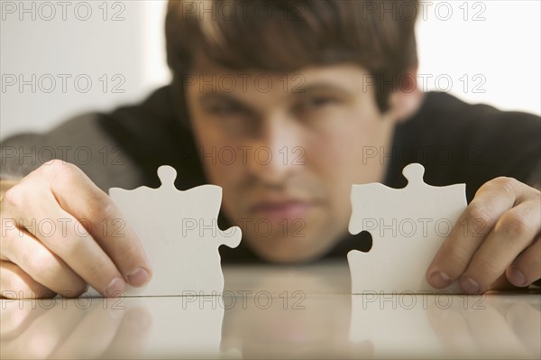 Man with puzzle pieces.