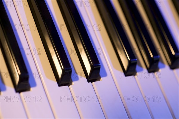 Closeup of piano keys.