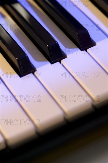 Closeup of piano keys.