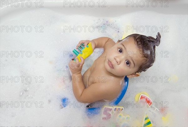 Looking down at a baby bathing.