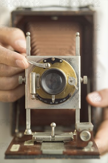 Using an antique folding camera.