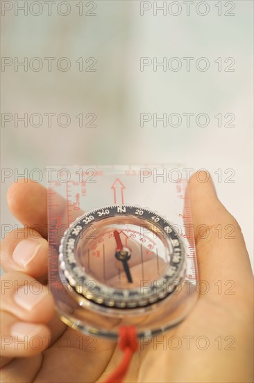 Man holding a compass.