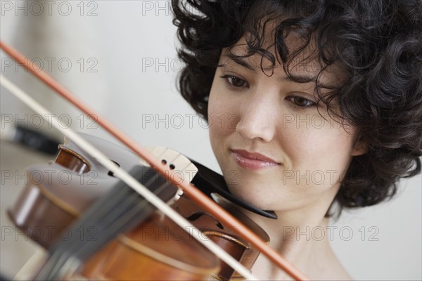 Woman playing the violin.