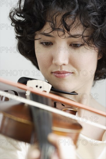 Woman playing the violin.