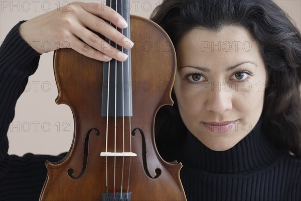 Portrait of a woman with her violin.