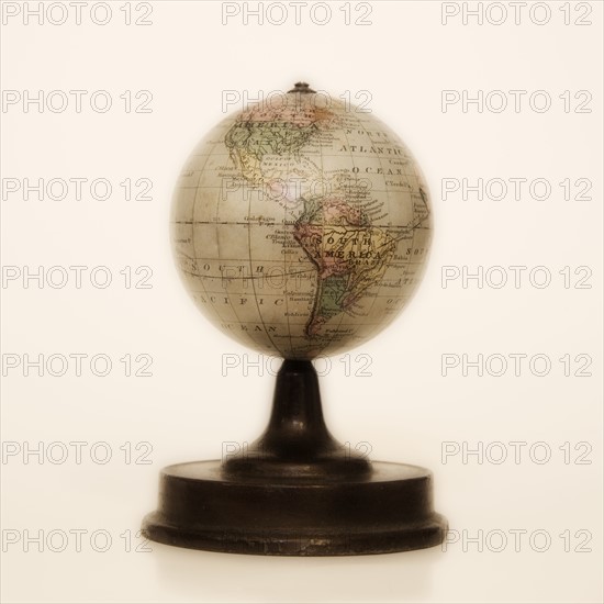 Antique globe on stand.