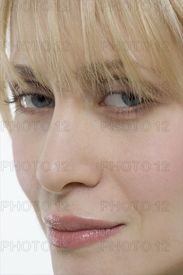 Closeup of woman looking sideways.