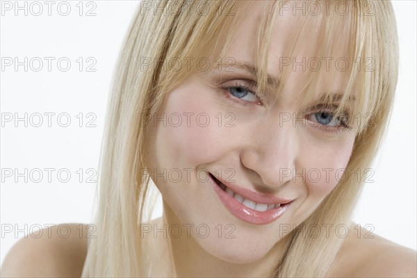 Head and shoulders of smiling woman.