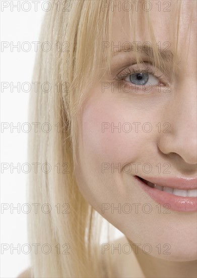 Partial view of smiling woman's face.