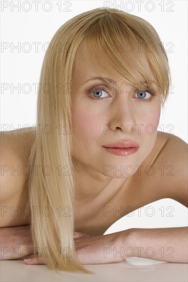 Blond woman gazing intensely.