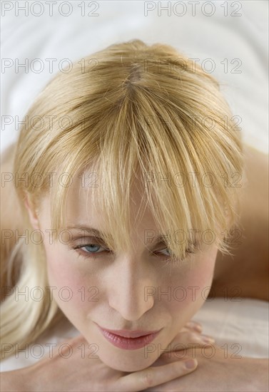 Woman lying on massage table.