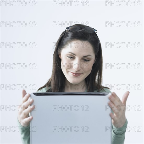 Happy woman with laptop.