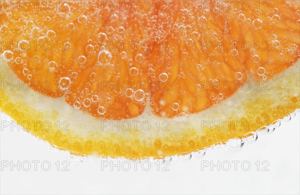 Extreme closeup of citrus fruit slice.