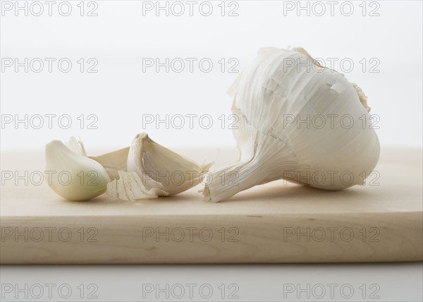 Garlic on cutting board.